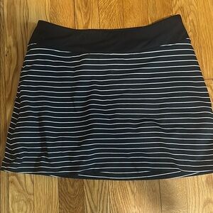 Black and White Striped Women's Skort. Right side zippered pocket.